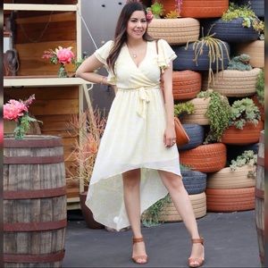 Light yellow floral dress with asymmetric hem